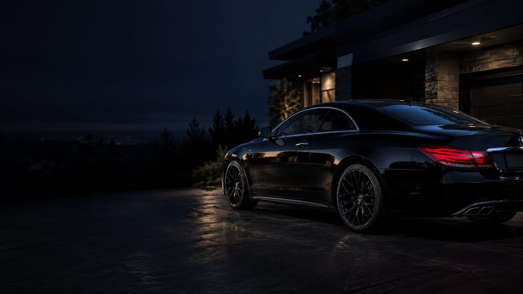 Black Mercedes detailed at night in an Ottawa driveway